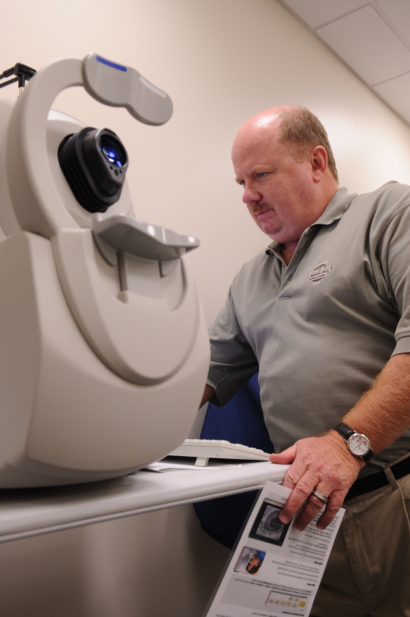 MOODY AIR FORCE BASE, Ga. -- Kevin Ott, representative from manufacturer Carl Zeiss Meditec Inc., sets up a high-definition optical coherence tomography (HD-OCT) machine Dec. 10. With this new machine, optical technicians can clearly see behind and beneath the eye to make proper diagnoses. (U.S. Air Force photo/Airman 1st Class Douglas Ellis)(RELEASED)