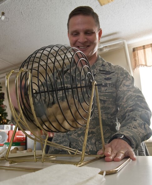 Col. Thomas Hesterman, 2nd Bomb Wing vice commander, calls out bingo numbers during the Hap House holiday party on Barksdale Air Force Base, La., Dec. 9. The holiday party consisted of food, games, and a visit from Santa Claus. Established in 1976, the Hap House is a non-profit organization on Barksdale providing more than 80 mentally and physically disabled adults the opportunity to earn a pay check. (U.S. Air Force Photo by Senior Airman Chad Warren) (RELEASED)