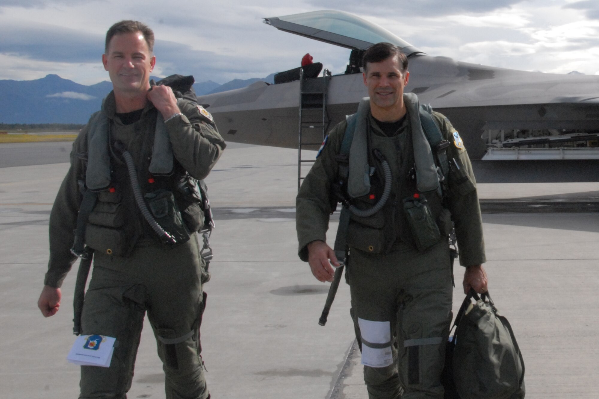 Air Force Col. Eric Overturf, former 477th Fighter Group commander (left) exits the flight line with Air Force Col. John Hillyer, who will lead the unit until a new commander is named. The 477th FG is the Air Force Reserve Command’s firs Raptor unit. (Air Force photo/Maj. Lisa Reaver)