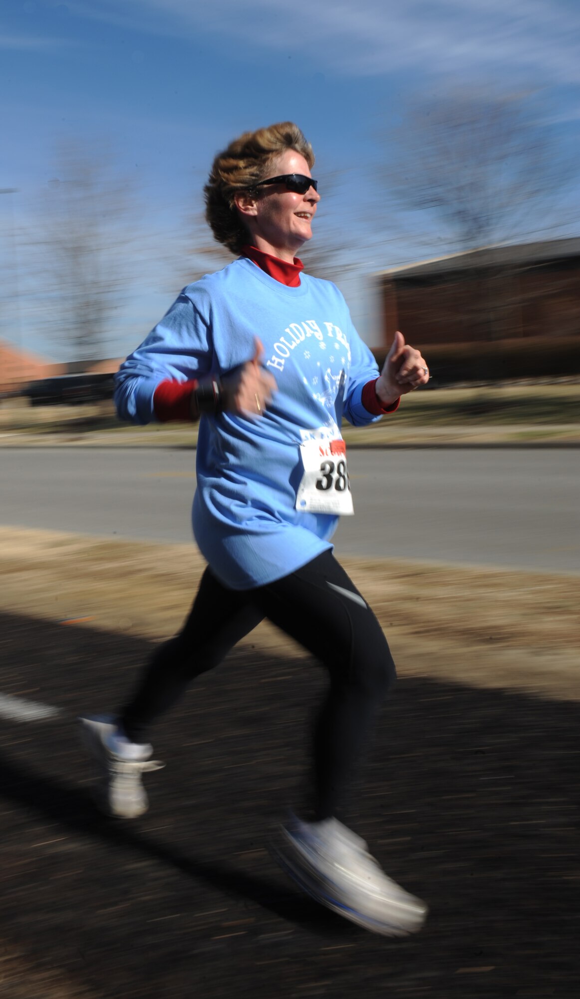 Runner number 386 sprints towards the finish line Dec. 10, 2010. More than 200 people participated in the event hosted by the 375th Force Support which was open to all members of Team Scott. (U.S. Air Force photo/ Airman 1st Class Divine Cox)