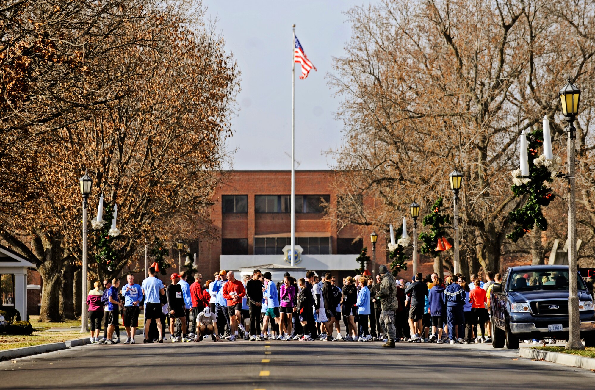 Runners, from various units throughout Scott Air Force Base, take their place at the starting line during the Holiday Frigid 5K Dec 10. More than 200 people participated in the event hosted by the 375th Force Support which was open to all members of Team Scott. (U.S. Air Force photo/ Staff Sgt. Ryan Crane)