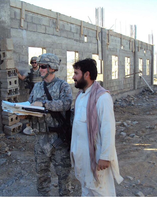 Air Force 1st Lt. Joshua J. Carroll, 577th Prime Base Engineer Emergency Force Squadron, Task Force Rakkasan Detachment, Salerno, Afghanistan, deputy officer in charge, looks over drawing of the project at Contingency Outpost Chergotah, Afghanistan. Lieutenant Carroll is from the 97th Civil Engineer Squadron, Altus Air Force Base, Oklahoma. (Courtesy photo)