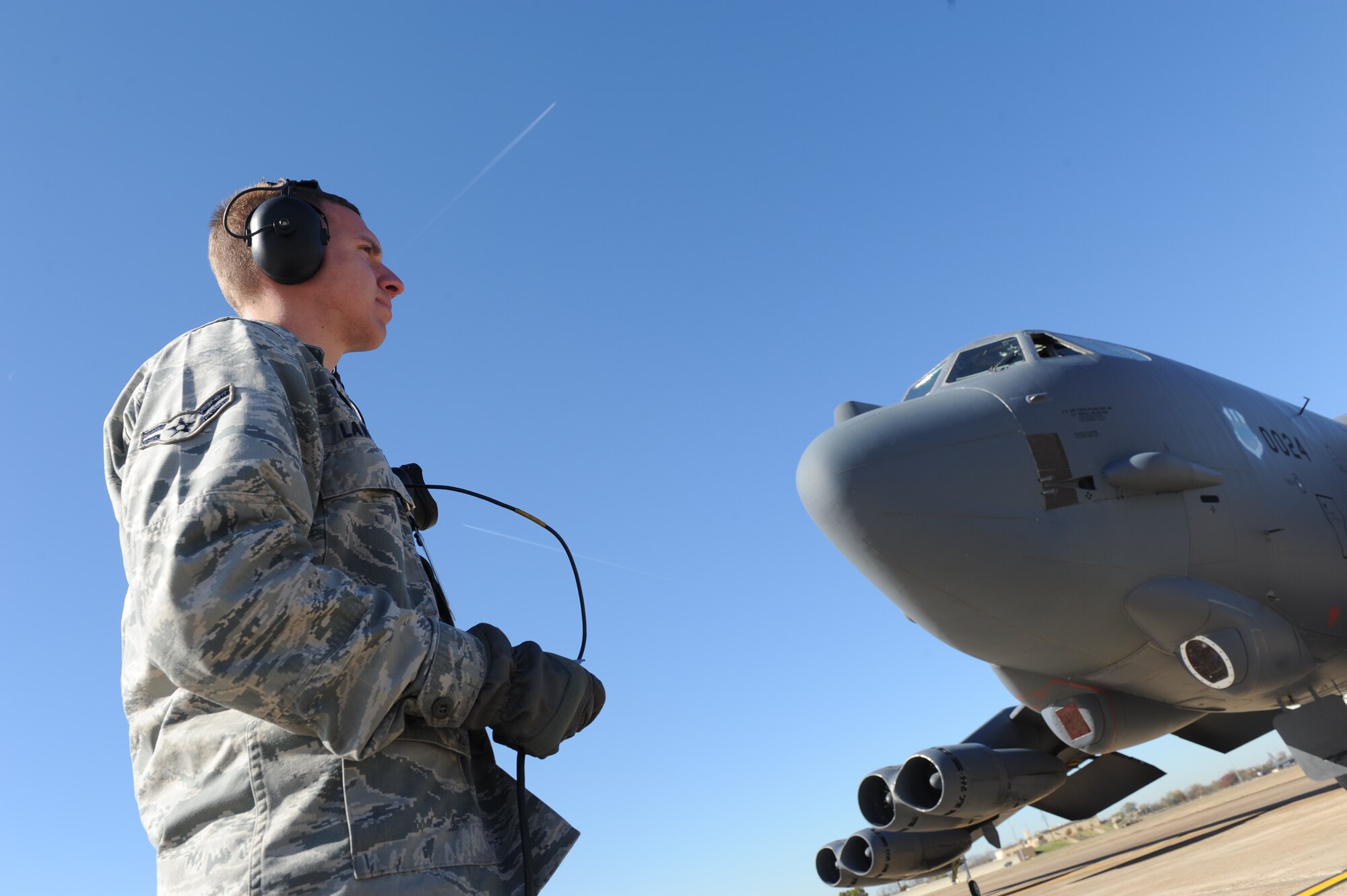 Airman 1st Class James Lawson, a crew chief with the 2nd Maintenance Squadron, waits for an all clear before a B-52H Stratofortress aircraft takes off from Barksdale Air Force Base, La., Dec. 1. (U.S. Air Force photo by Staff Sgt. Chad Trujillo/Released)