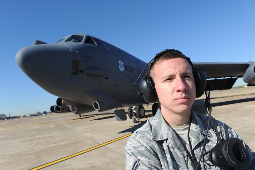 Airman 1st Class James Lawson, a crew chief with the 2nd Maintenance Squadron, waits for an all clear before a B-52H Stratofortress aircraft takes off from Barksdale Air Force Base, La., Dec. 1. (U.S. Air Force photo by Staff Sgt. Chad Trujillo/Released)