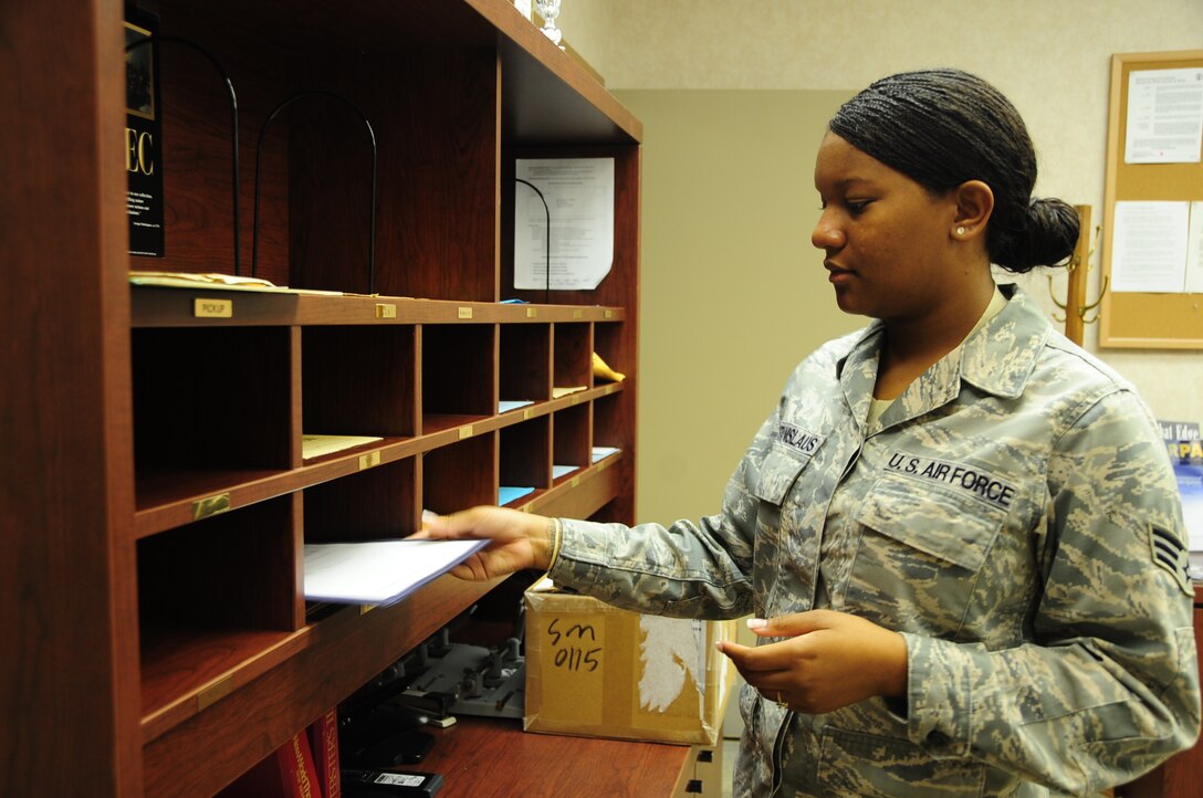 Senior Airman Megan Stanislaus, 28th Bomb Wing Knowledge Operations manager, sorts mail for various organizations, Aug. 5. Airman Stanislaus is spotlighted Airmen for the month of August.