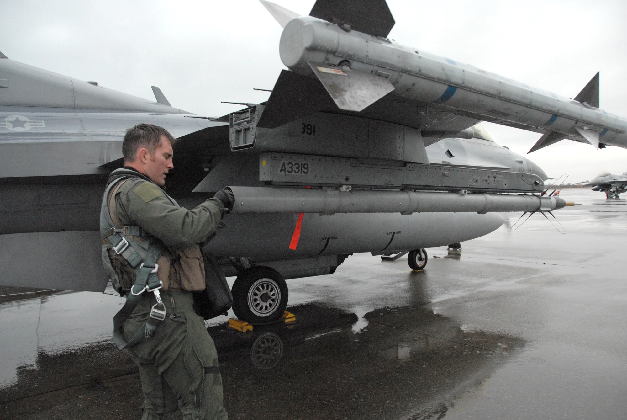 Capt. Matt Hepp conducts a preflight inspection before a flying mission Dec. 7, 2010, over the Sea of Japan. More than 160 Airmen from Misawa Air Base, Japan, are deployed to Komatsu Japanese Air Self-Defense Force Base, Japan, Dec. 3 to 11 in support of Exercise Keen Sword 2011. Captain Hepp is a 14th Fighter Squadron F-16 Fighting Falcon pilot. (U.S. Air Force photo/1st Lt. Cammie Quinn)