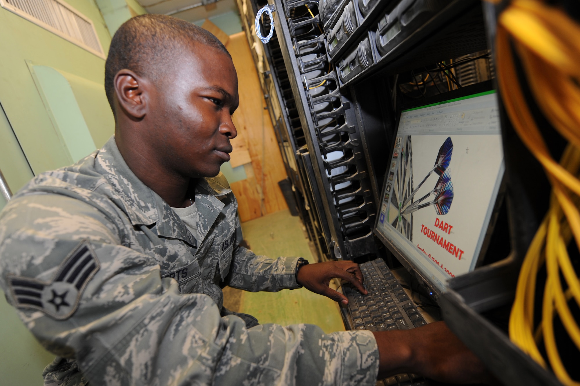 Senior Airman Mawali Roberts installs updates to the Commander’s Access Channel Dec. 10, 2010, at Kandahar Airfield, Afghanistan. Airmen of the 451st Expeditionary Communications Squadron are responsible for managing, maintaining, and operating more than $30 million worth of equipment and keeping 2,000-3,000 customers happy. Airman Roberts, from Queens, N.Y., is a knowledge operations management journeyman assigned to the 451st ECS. (U.S. Air Force photo by Tech. Sgt. Chad Chisholm/Released)