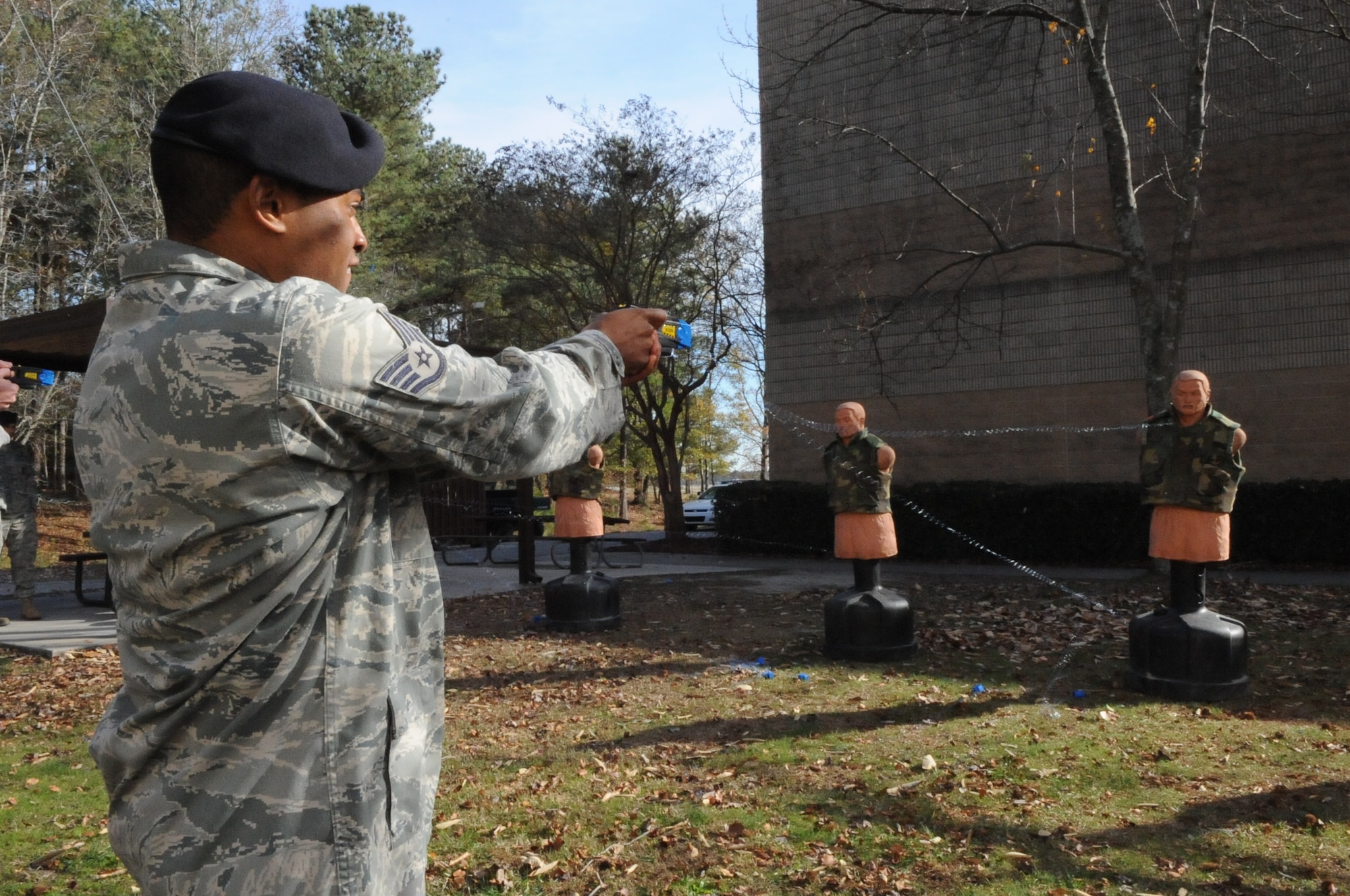 SEYMOUR JOHNSON AIR FORCE BASE, N.C. -- Staff Sgt. Decota Thomas fires a 226 model taser during training here, Dec. 8, 2010. During the practical portion of the training, the Airman must shoot a dummy twice utilizing the laser sighting and once using the iron sight. Sergeant Thomas is a 4th Security Forces Squadron patrolman from Greenville. (U.S. Air Force photo/Staff Sgt. Courtney Richardson)(RELEASED)
