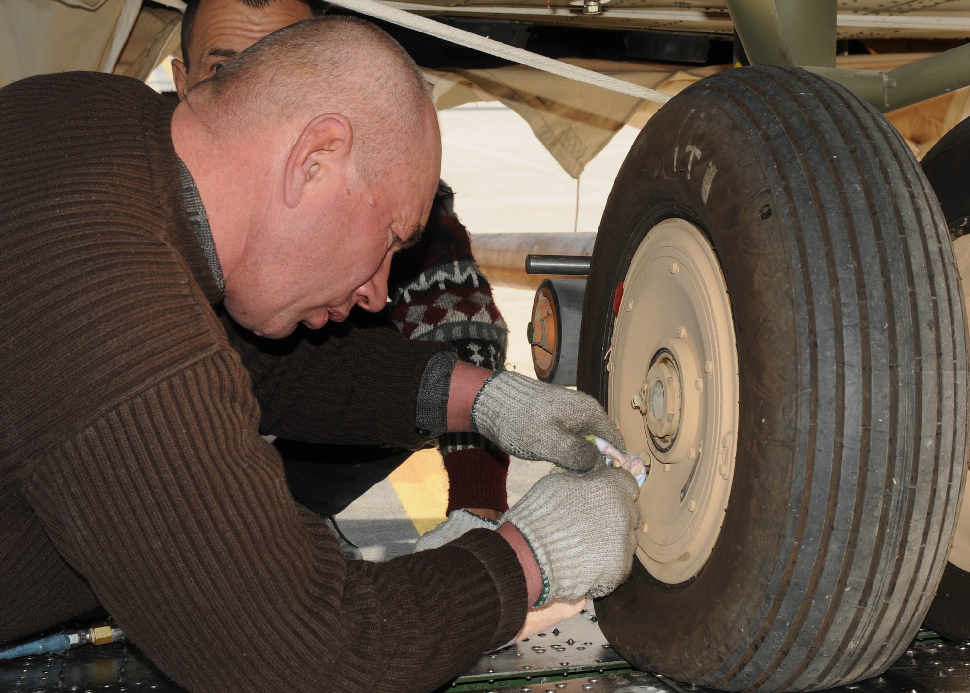 101210-N-6541W-002 KABUL, Afghanistan - The Afghan Air Force accepts delivery of four Mi-17s V5 helicopters at the air force base in Kabul  on Dec. 10.  (U.S. Navy photo by Mass Communication Specialist 2nd Class Vladimir Potapenko/ RELEASED).