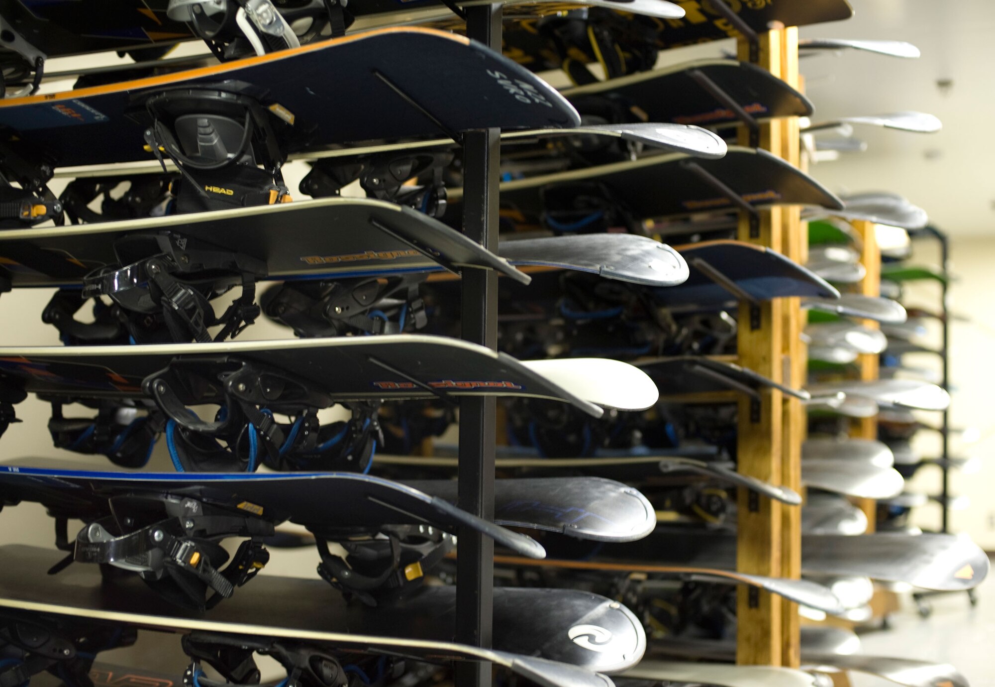 Snowboards line the racks of Outdoor Recreation at the Weasels’ Den, Dec. 8, 2010, at Misawa Air Base, Japan. Outdoor Recreation offers rentals on various gear including snowboards, boots, skis and snowshoes. Outdoor Recreation also sponsors more than 150 trips, tours and classes a year, recently adding paragliding, caving, hiking, biking, snowshoeing and canyon trips. (U.S. Air Force photo by Airman James B. Bauer/Released)