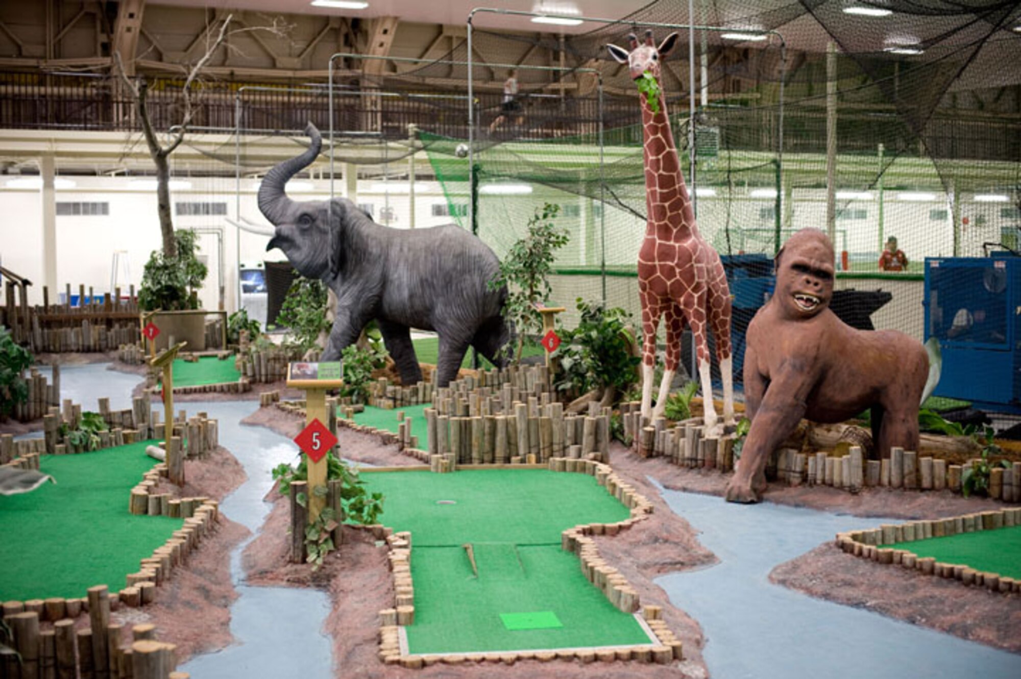 The Weasels’ Den at Misawa Air Base, Japan, has a safari-themed mini-golf course. Batting cages, video games and an air hockey table are also available. The Weasels’ Den encompasses 66,000 square feet and receives 8,000 visitors during the winter months, and 2,000 to 3,000 during the summer. (U.S. Air Force photo by Airman James B. Bauer/Released)