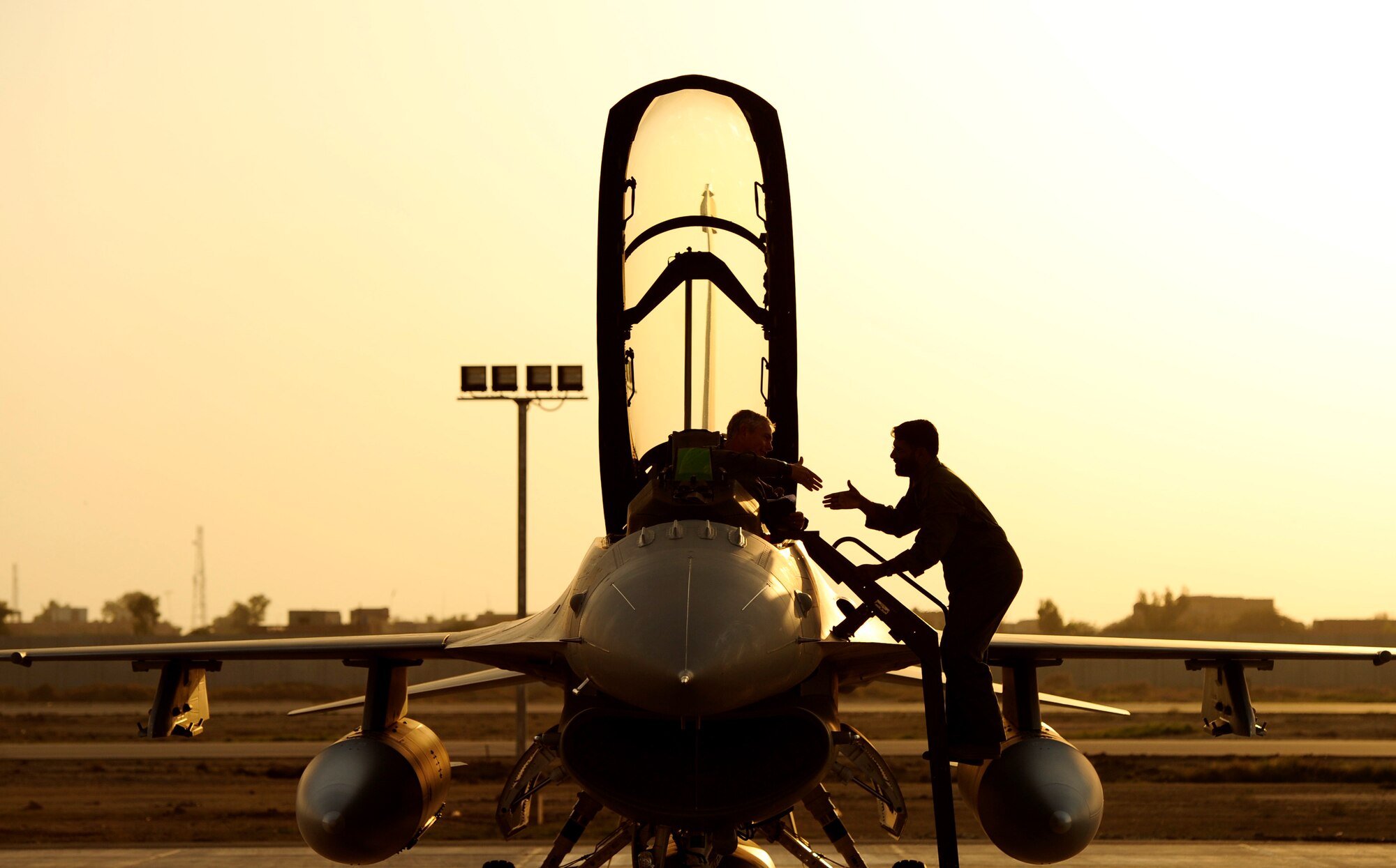 Lt. Col. Doug Read accepts a warm welcome at Shahbaz AB, Pakistan, after he and fellow 176th Fighter Squadron pilots Majors Bart Van Roo and Chris Hansen delivered three new F-16s to the Pakistani Air Force on October 30, 2010.