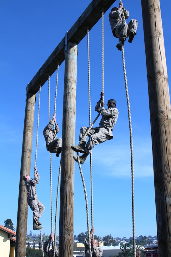 Scaling the rope climb portion of the depot’s obstacle course is the last event Company F recruits have to do before they are finished with the training event, Dec. 11. The obstacle course is part of third phase recruit training aboard Marine Corps Recruit Depot San Diego. They ran the entire course twice, scaling the rope only once, before performing fireman carries and buddy drags.