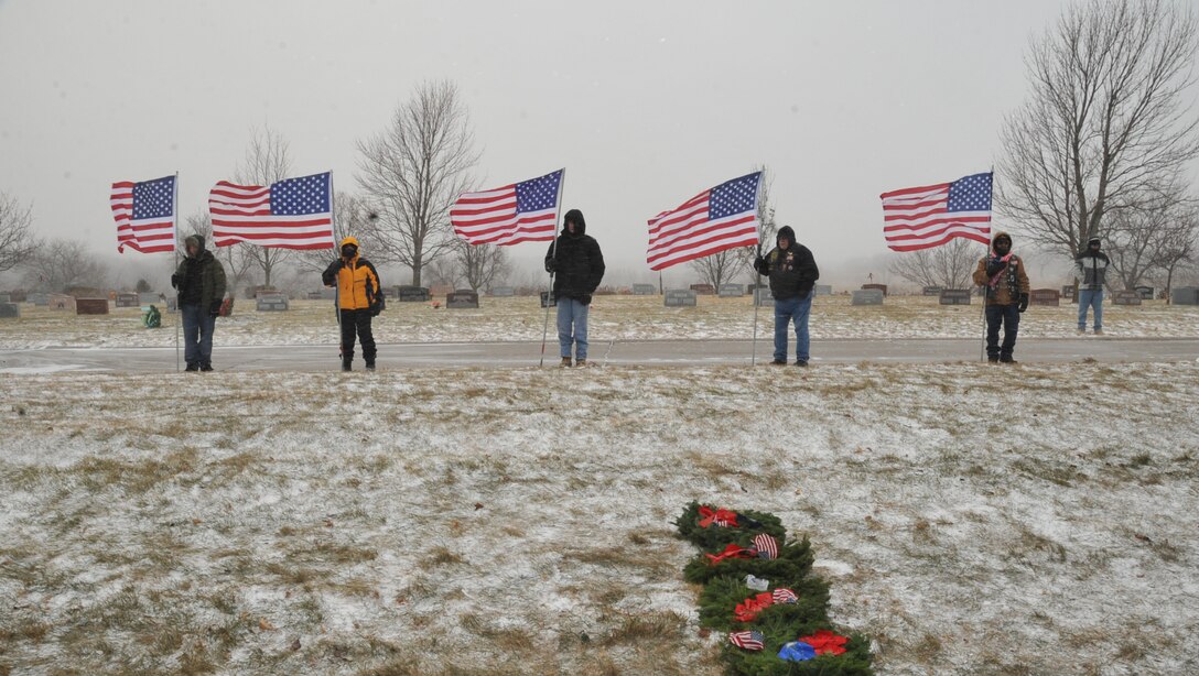 Members of Patriot Guard Riders hold the colors during the annual Wreaths Across America ceremony Dec. 11 at the Forest Lawn Cemetery. Wreaths Across America is a non-profit organization and annual event held simultaneously across the country to honor the service and sacrifice of America's fallen servicemembers.