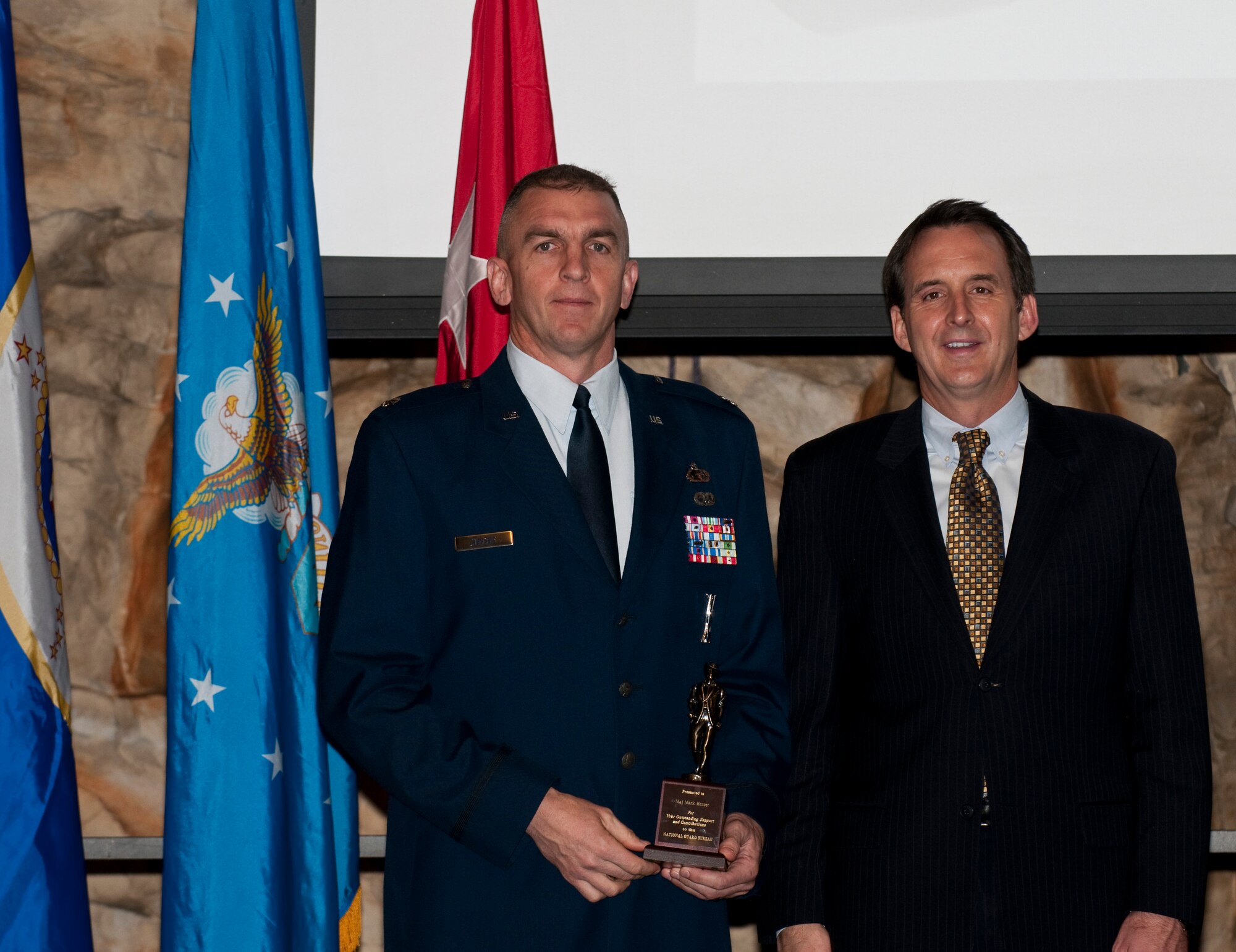 Governor of Minnesota Tim Pawlenty (right) stands with Air National Guard Equal Opportunity Professional of the Year, Lt. Col. Mark Hesser, 133rd Airlift Wing, during the Wing Recognition Ceremony Dec. 11, 2010 in St. Paul, Minn.
USAF official photo by Tech. Sgt. Erik Gudmundson