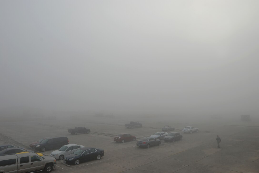 A thick blanket of winter morning fog obscures visibility of the flightline and and the giant C-5A Galaxy aircraft of the 433rd Airlift Wing, Lackland Air Force Base, Texas, Dec 11, 2010. (U.S. Air Force photo/Airman 1st Class Brian McGloin)