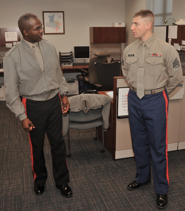 Maj. Gen. Ronald L. Bailey, commanding general of the Western Recruiting Region, speaks with Sgt. Dustin R. Andrews, 8th Marine Corps logistics clerk, during his visit to the district headquarters Dec. 13, 2010. Bailey spoke one-on-one with headquarters Marines before continuing his tour around the district's area of responsibilty.