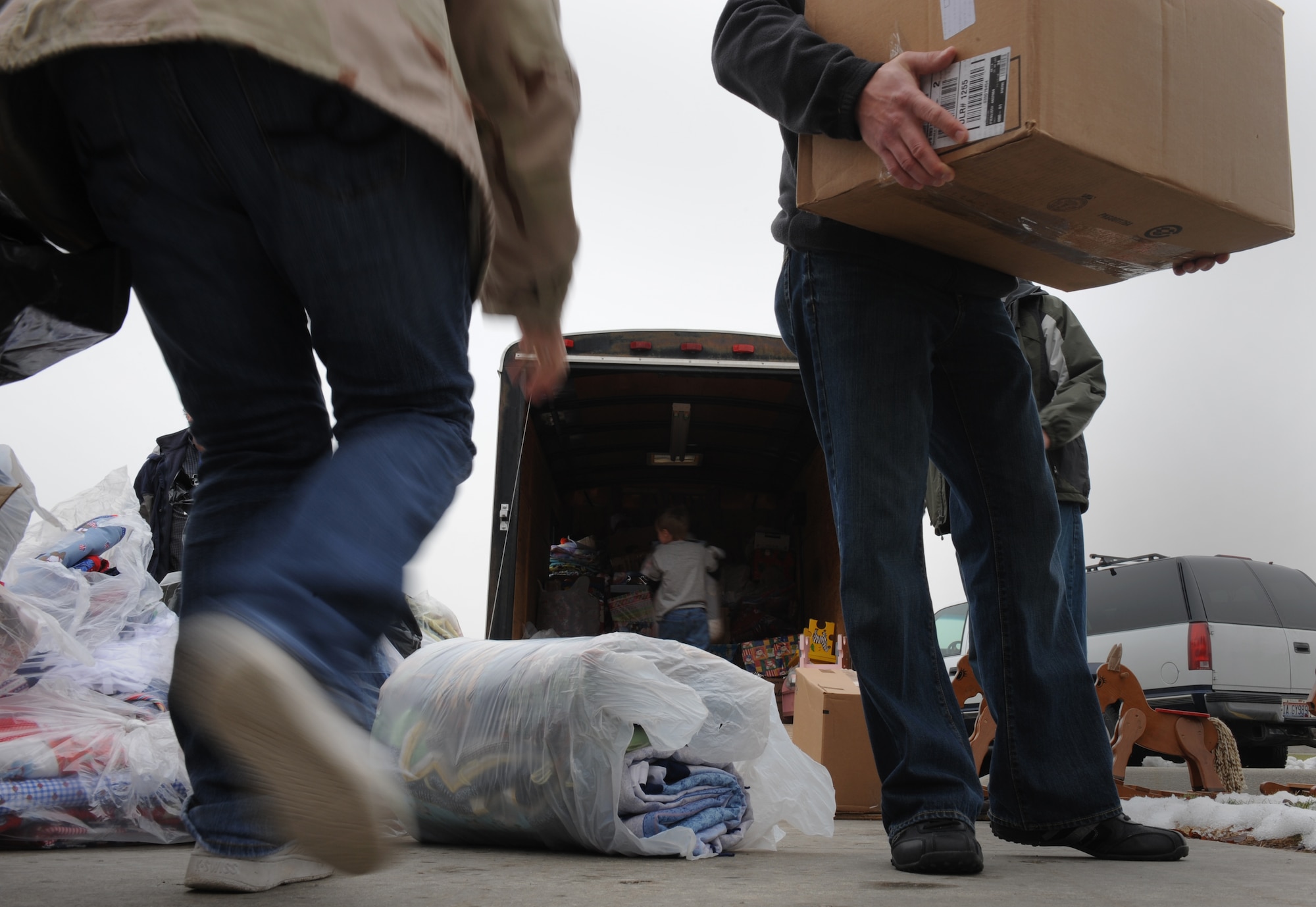 MOUNTAIN HOME AIR FORCE BASE, Idaho -- Members of Operation Warmheart and volunteers help load a trailer full of toys and food items during the Silver Crest II Annual Holiday Social in Nampa, Idaho, Dec. 11. Every year hundreds of toys and quilts and more than a thousand pounds of food are donated to help military families during the holiday season. This year the community donated $17,000. (U.S. Air Force photo by Staff Sgt. Gina Chiaverotti-Paige)