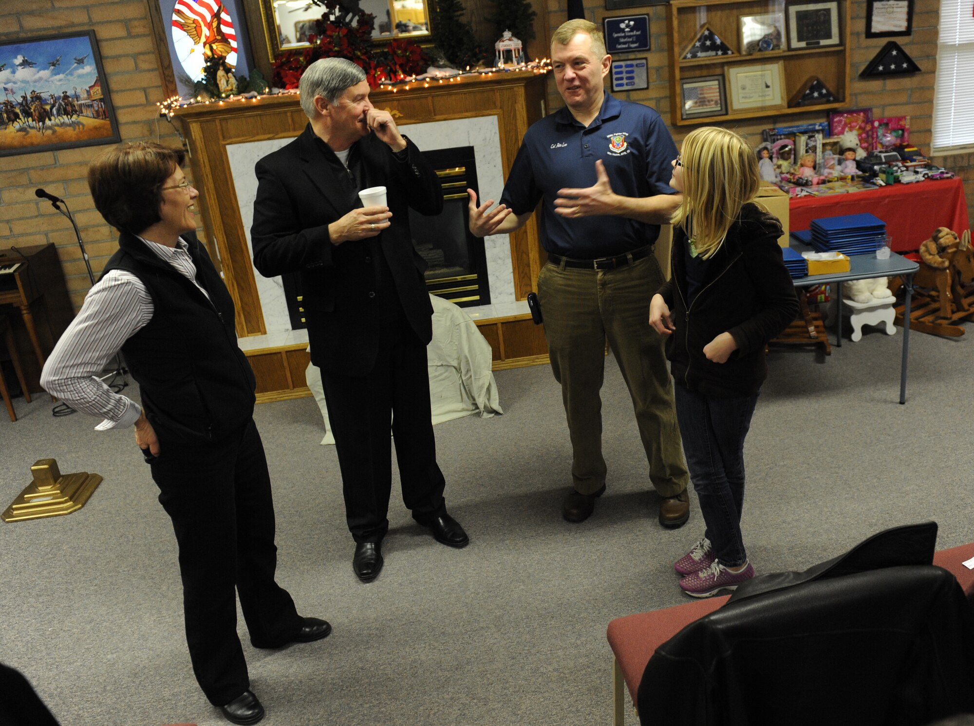 MOUNTAIN HOME AIR FORCE BASE, Idaho -- From left, Janice Wong and Don Gillispie speak with Col. Pete Lee, 366th Fighter Wing vice commander, and his daughter, Anna, during the Silver Crest II Annual Holiday Social in Nampa, Idaho, Dec. 11. Every year hundreds of toys and quilts and more than a thousand pounds of food are donated to help military families during the holiday season. This year the community donated $17,000. (U.S. Air Force photo by Staff Sgt. Gina Chiaverotti-Paige)
