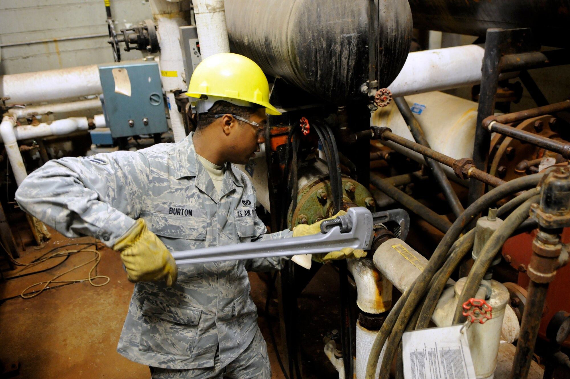 Airman 1st Class Chad Burton checks various components within a boiler room that provides needed heat to a building Nov.30, 2010, Eielson Air Force Base, Alaska. The 354th Civil Engineering Squadron heating ventilation air conditioning shop provides the manpower to maintain very dangerous components to allow Team Eielson to remain mission-ready. Airman Burton is assigned to the 354th CES HVAC shop. (U.S. Air Force photo by/Airman 1st Class Yash Rojas)