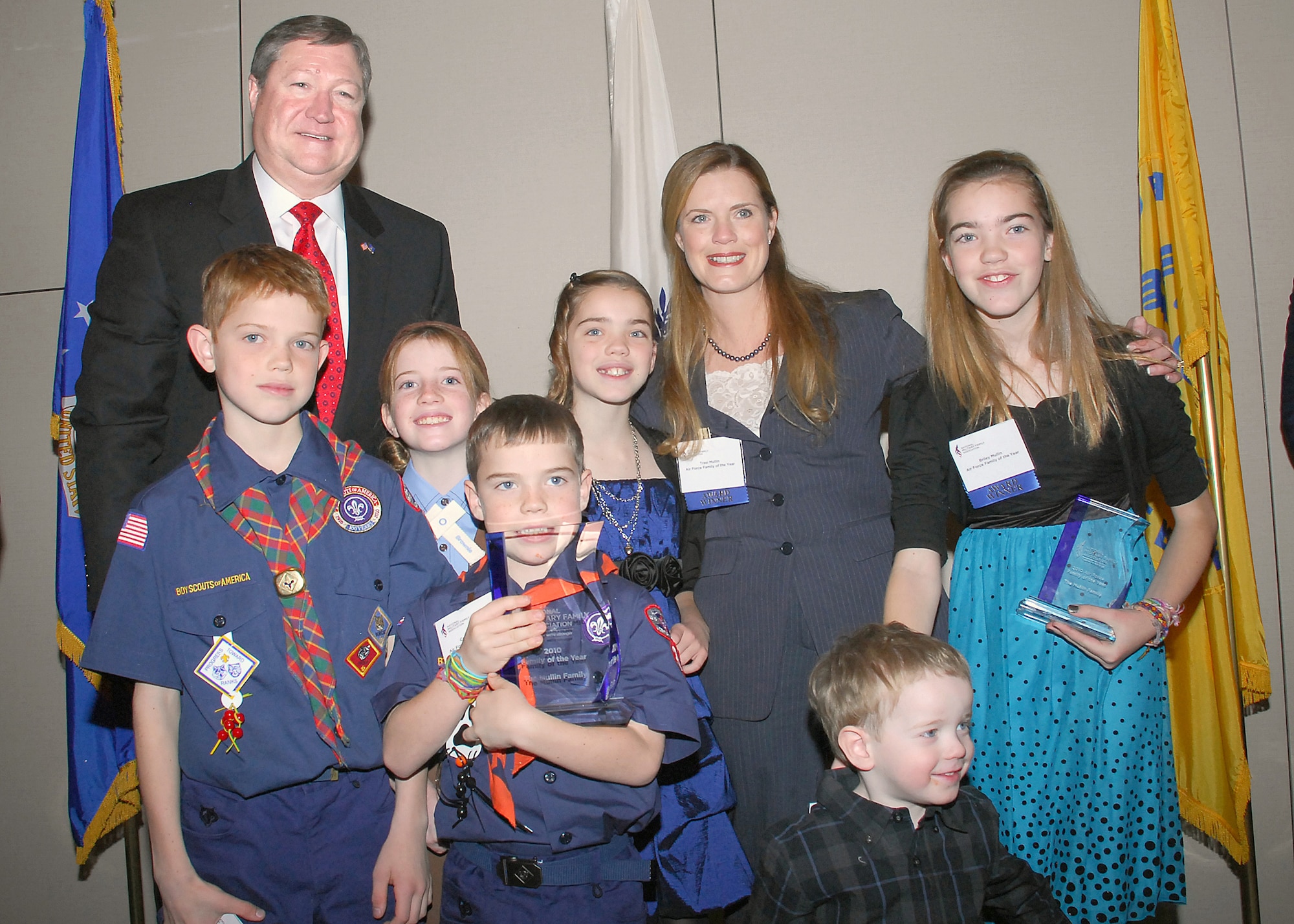 Secretary of the Air Force Michael Donley presents the Mullin family with a plaque, after the family was named the 2010 Military Family of the Year at the National Military Family Association Leadership Luncheon Dec. 7, 2010, in Arlington, Va. Officials also recognized the contributions of the families of the year from the Army, Navy, Marine Corps, Coast Guard, Public Health Service, and National Oceanic & Atmospheric Administration. The Mullin family is stationed at Randolph Air Force Base, Texas, and Lt. Col. Brian Mullin is deployed to Iraq. (U.S. Air Force photo/Master Sgt. Raheem Moore)
