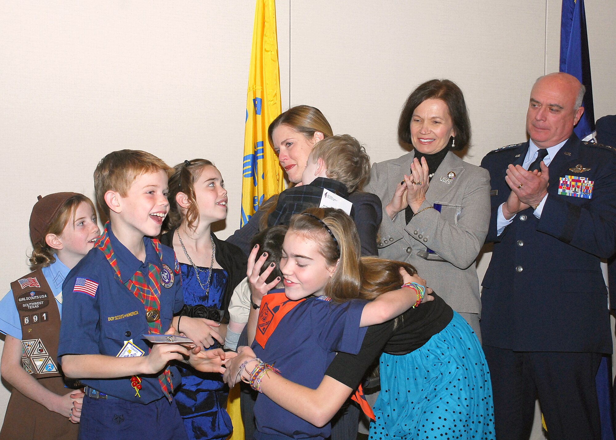 Air Force Vice Chief of Staff Gen. Carrol H. "Howie" Chandler, and his wife Eva-Marie Chandler, congratulate the Mullin family, after the family was named the 2010 Military Family of the Year at the National Military Family Association Leadership Luncheon Dec. 7, 2010, in Arlington, Va. Officials also recognized the contributions from the families of the year from the Army, Navy, Marine Corps, Coast Guard, Public Health Service, and National Oceanic & Atmospheric Administration. The Mullin family is stationed at Randolph Air Force Base, Texas, and Lt. Col. Brian Mullin is deployed to Iraq. (U.S. Air Force photo/Master Sgt. Raheem Moore)