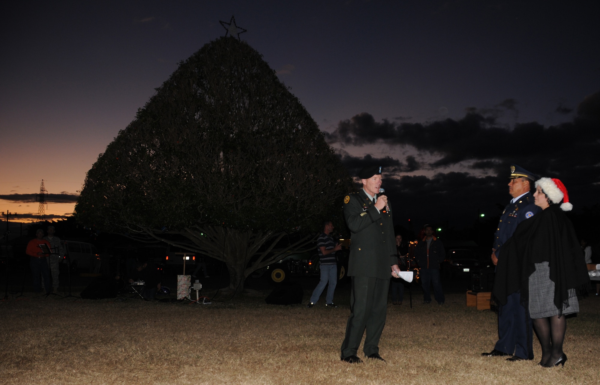 SOTO CANO AIR BASE, Honduras --  Col. Gregory Reilly, left, the Joint Task Force-Bravo commander, and Col. Wilfredo Reyes, the Honduran Air Force Academy commandant, greet Honduran Air Force and U.S. servicemembers during the Christmas tree lighting ceremony here Dec. 10. (U.S. Air Force photo/Tech. Sgt. Benjamin Rojek)