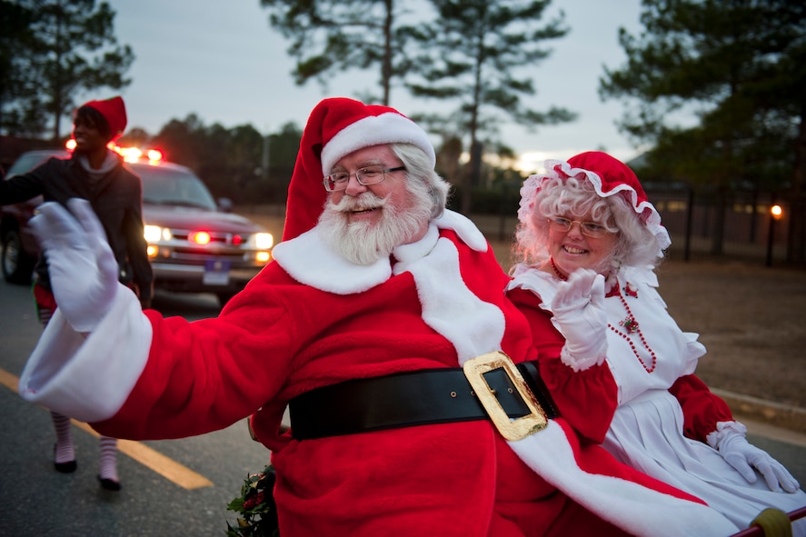 MOODY AIR BASE, Ga. -- Mr. and Mrs. Claus greet children during the Annual Base Tree Lighting and Holiday Parade Dec. 10. Santa later gave the children an opportunity to meet him and give him their Christmas wishes. (U.S. Air Force photo/Senior Airman Jamal D. Sutter)(RELEASED)