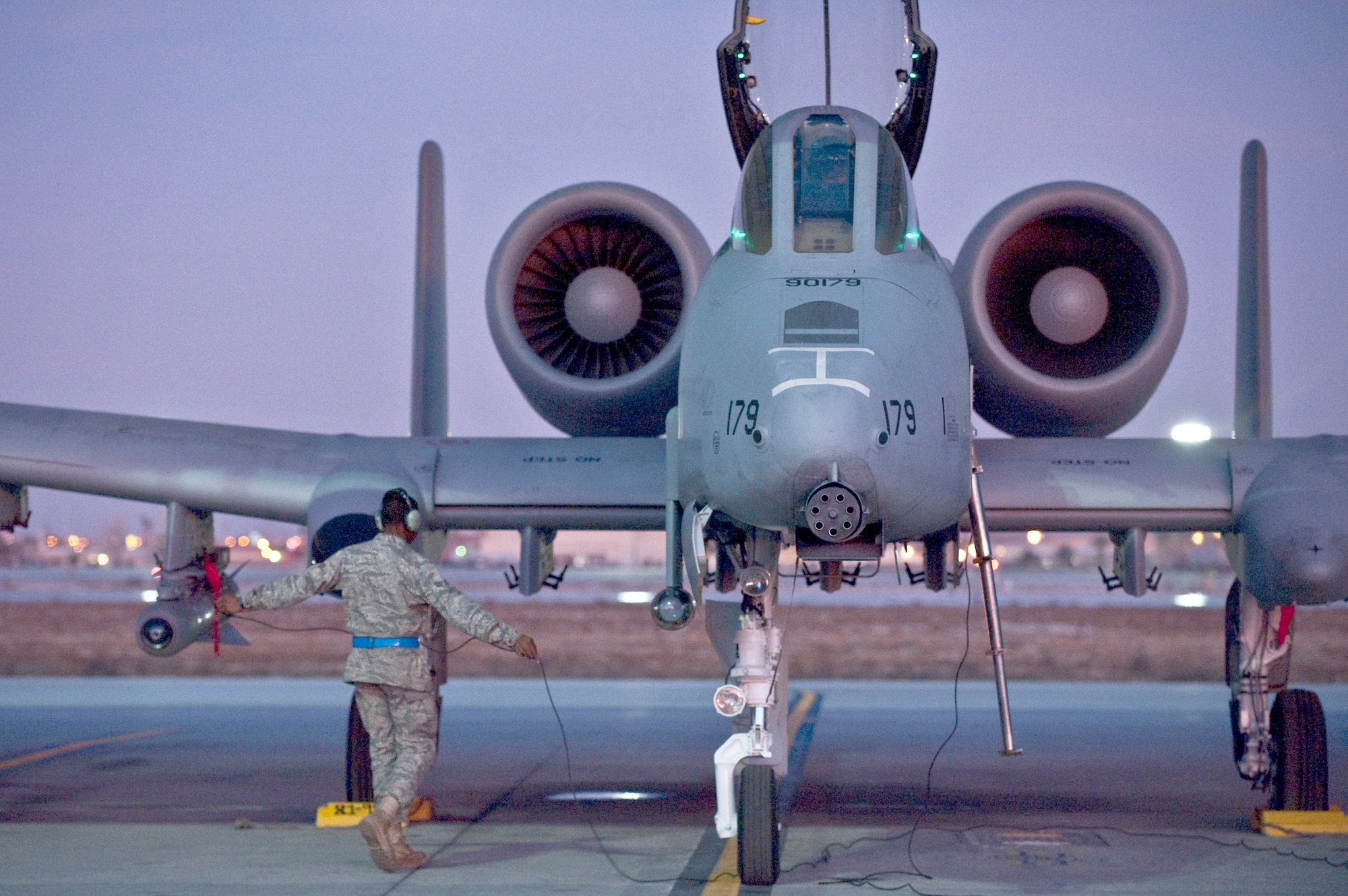 Senior Airman Edwin Watkins conducts a pre-flight check on an A-10 Thunderbolt II before a training mission during the Green Flag West 11-2 exercise Dec. 10, 2010, at Nellis Air Force Base, Nev. He is a crew chief with the 23rd Aircraft Maintenance Squadron at Moody AFB, Ga. (U.S. Air Force photo/Tech. Sgt. Michael R. Holzworth)