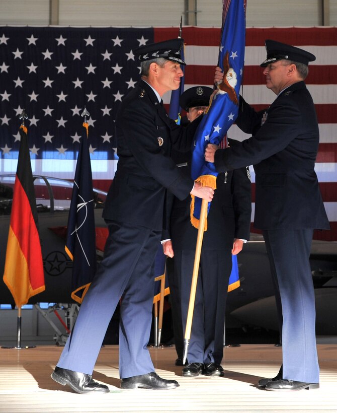 Air Force Chief of Staff Gen. Norton Schwartz gives Gen. Mark A. Welsh III, the command of U.S. Air Forces in Europe during a change of command ceremony, Ramstein Air Base, Germany, Dec. 13, 2010. Gen. Roger A. Brady, outgoing USAFE commander, relinquished command during the change of command ceremony after providing command and control for air, space and missile defense for activities in an area of operations covering almost one-fifth of the globe which included 51 countries in Europe, Asia, the Middle East, and the Arctic and Atlantic oceans. (U.S. Air Force photo by Senior Airman Caleb Pierce)
