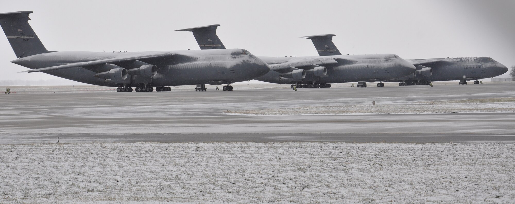 WRIGHT-PATTERSON AIR FORCE BASE, Ohio - Snow falls across the 445th Airlift Wing Dec. 12, highlighting the beauty of the C-5 Galaxy. (U.S. Air Force photo/Staff Sgt. Amanda Duncan)