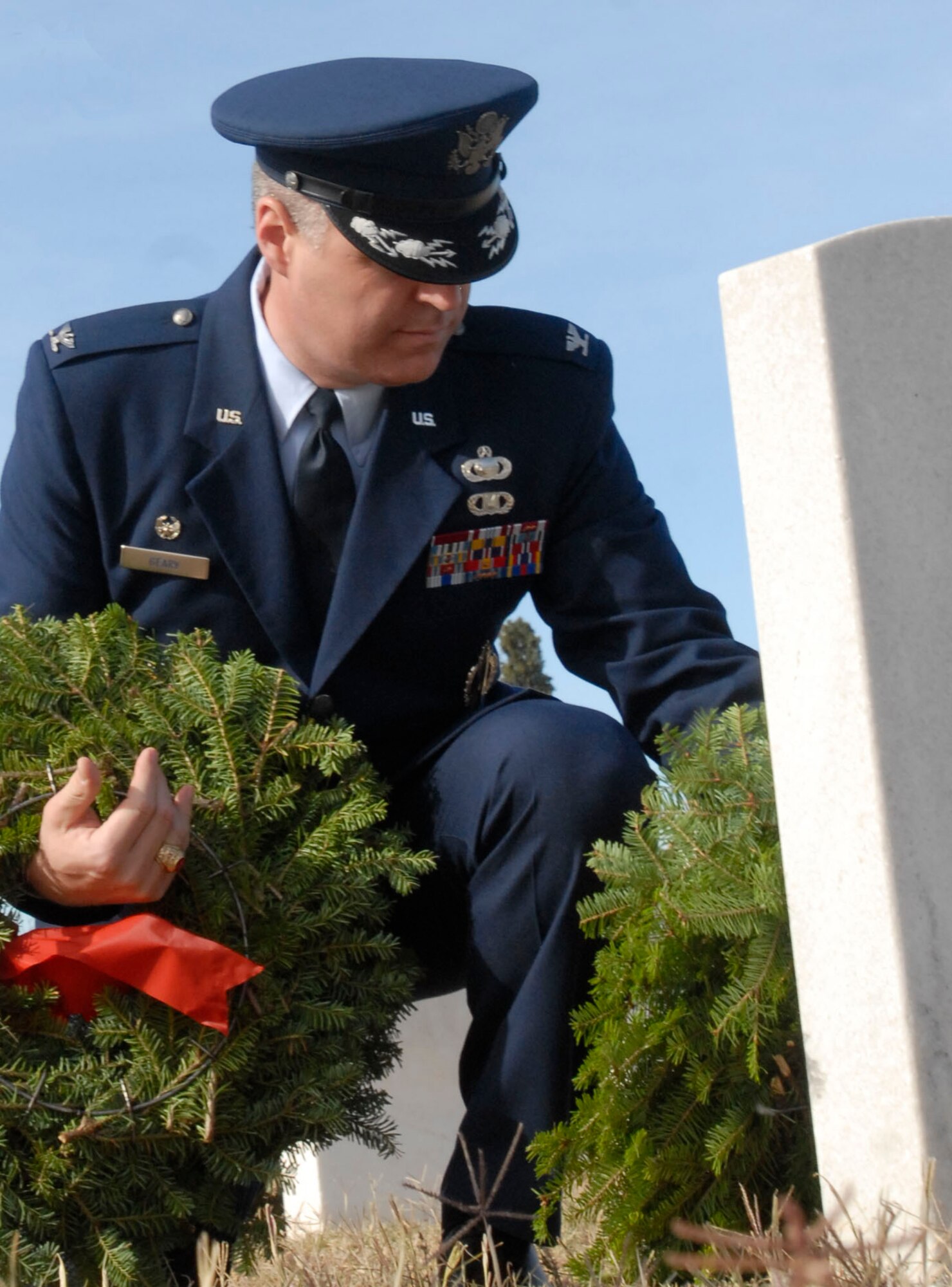 SAN ANGELO, Texas – Col. Thomas Geary, 17th Training Wing Commander, lays a wreath on a veteran’s grave in San Angelo’s Belvedere Cemetery during the National Wreaths Across America Ceremony Dec. 11.  Wreaths Across America was formed in 2007 to promote veterans remembrance.  Wreaths are placed on veterans graves during the holiday season.  (U.S. Air Force photo/Kent Cummins)