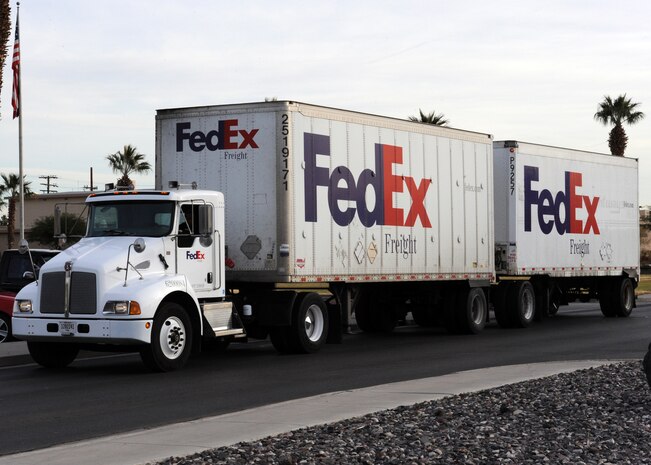 NELLIS AIR FORCE BASE, Nev.-- A FedEx truck arrives at the base chapel with Christmas trees for Trees for Troops Dec. 10.Trees for Troops, a charity program sponsored by the Christmas SPIRIT Foundation and FedEx, donated more than 650 Christmas trees to Nellis and Creech Airmen and their families.  (U.S. Air Force photo by Airman 1st Class Matthew Lancaster)