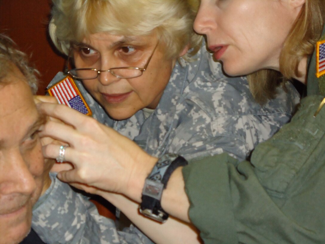 For battlefield acupuncture, Niemtzow uses only five points on each ear. Small, 1-millimeter gold or stainless steel needles are inserted and stay in place until they fall out or the patient removes them several days later.  Colonel Renata J. M. Engler, MD
Director, Vaccine Healthcare Center Network Allergy-Immunology learns how to do it
during a workshop at the Air Force Acupuncture Center at Joint Base Andrews in Maryland, Dec. 9, 2010. The purpose of the class was to teach battlefield acupuncture to military physicians from Walter Reed Army Medical Center.