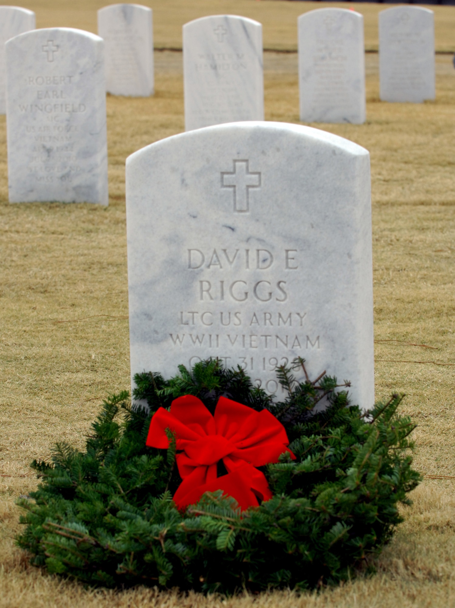 COLUMBIA, S.C. -- A wreath lays on the tombstone of a veteran at Fort Jackson National Cemetery at the Wreaths Across America ceremony Dec. 11, 2010. The ceremony was held to remember our veterans who have passed, honor those who are serving and have served and teach our children what it means to serve our country.The ceremony included a memorial presentation, World War II wreath laying, recognition of prisoners of war, those still missing in action and Merchant Marines, a 21-gun salute by a cannon battery and buglers.

