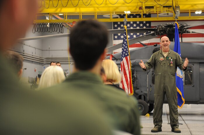 NELLIS AIR FORCE BASE, Nev.-- Maj. Yonel "Yogi" Dorelis talks to members of the 66th Rescue Squadron at his retirement ceremony Dec. 10. Major Dorelis retired after a helicopter flying career spanning 28 years in which he was part of all four U.S. military branches. (U.S. Air Force photo by 2nd Lt. Ken Lustig)