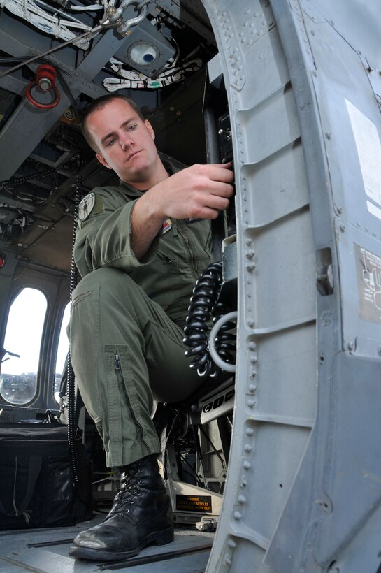 Senior Airman Jacob Ellwood conducts a preflight check on a HH-60G Pave Hawk at Moffett Federal Airfield, Calif., Nov. 06, 2010. Ellwood a flight engineer in the 129th Rescue Squadron is featured as this month's Portrait of a Professional.(Air National Guard photo by Staff Sgt. Kim E. Ramirez/Released)