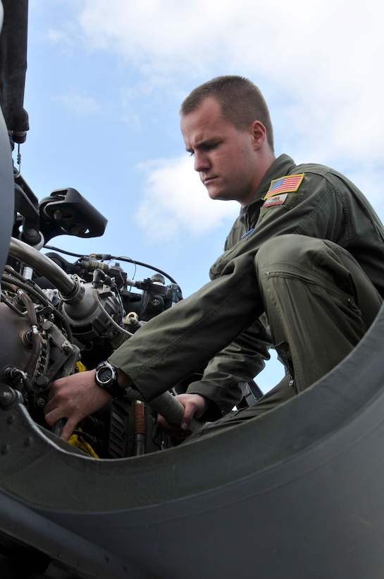 Senior Airman Jacob Ellwood conducts a preflight check on a HH-60G Pave Hawk at Moffett Federal Airfield, Calif., Nov. 06, 2010. Ellwood a flight engineer in the 129th Rescue Squadron is featured as this month's Portrait of a Professional.(Air National Guard photo by Staff Sgt. Kim E. Ramirez/Released)