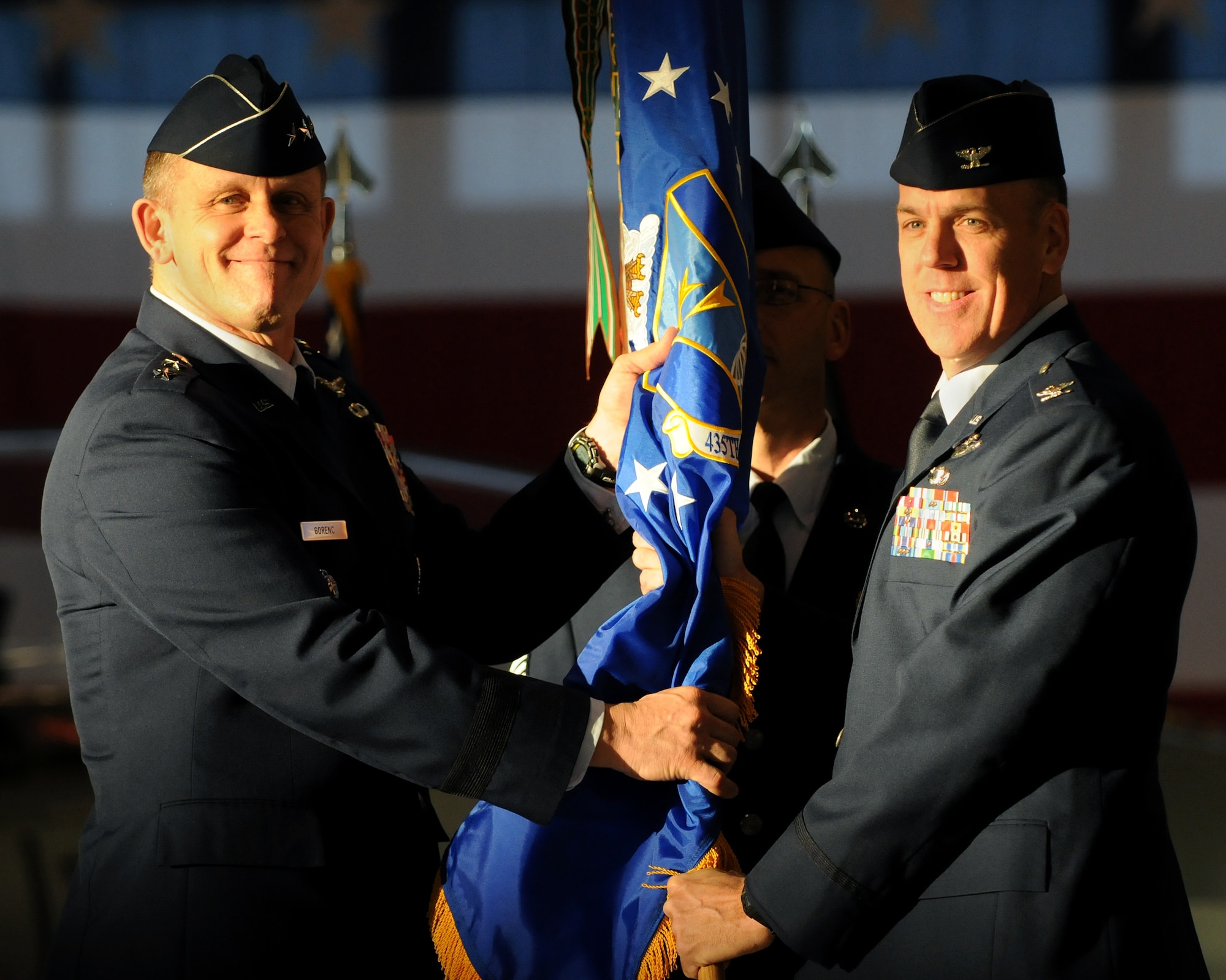 U.S. Air Force Lt. Gen. Frank Gorenc, 3rd Air Force commander, passes the guide-on to Col. John Shapland, as he takes command of 435th Air Ground Operations Wing, during the 435th AGOW Change of Command ceremony held on Ramstein Air Base, Germany, Dec. 13, 2010. (U.S. Air Force photo by Staff Sgt. Nathan Lipscomb)