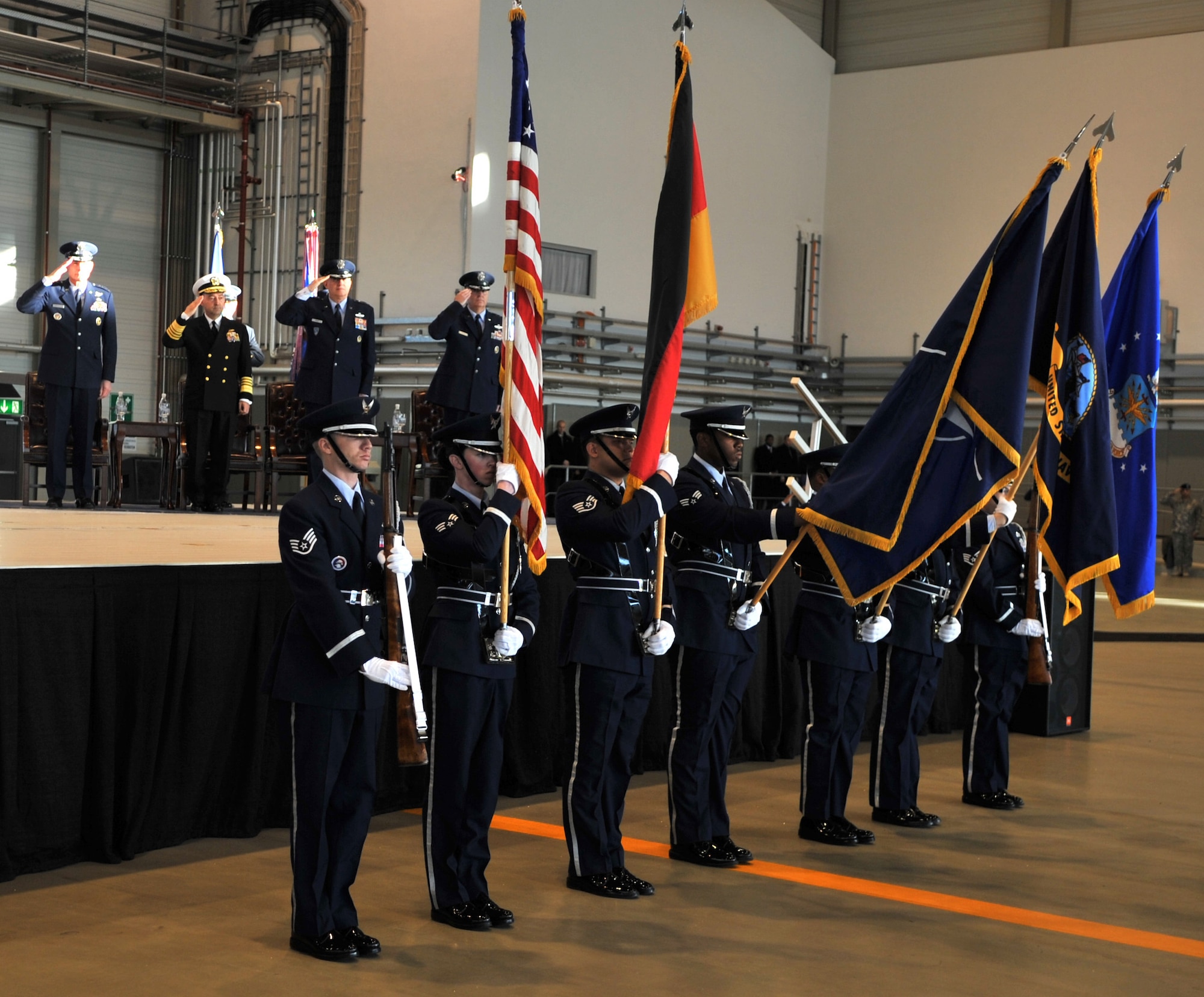 Air Force Chief of Staff Gen. Norton Schwartz, Navy Adm. James G. Stavridis, European Command and Supreme Allied Commander, Europe, Gen. Roger A. Brady, outgoing U.S. Air Forces in Europe commander, and incoming Gen. Mark A. Welsh III, U.S. Air Forces in Europe commander, present arms during the posting of the colors and playing of the National Anthems to begin a change of command ceremony, Ramstein Air Base, Germany, Dec. 13, 2010. Gen. Brady, outgoing USAFE commander, relinquished command during the change of command ceremony after providing command and control for air, space and missile defense for activities in an area of operations covering almost one-fifth of the globe which included 51 countries in Europe, Asia, the Middle East, and the Arctic and Atlantic oceans. (U.S. Air Force photo by Senior Airman Caleb Pierce)