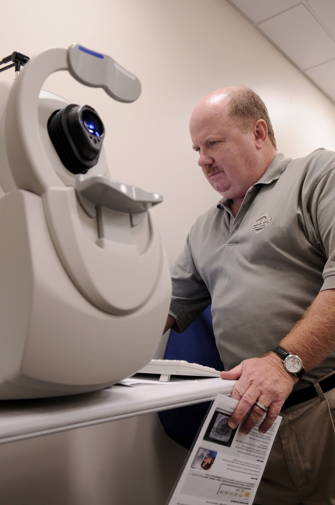 Kevin Ott, a representative from manufacturer Carl Zeiss Meditec, Inc., sets up a high-definition optical coherence tomography machine Dec. 10, 2010, at Moody Air Force Base, Ga. With this new machine, optical technicians can clearly see behind and beneath the eye to make proper diagnoses. (U.S. Air Force photo/Airman 1st Class Douglas Ellis)