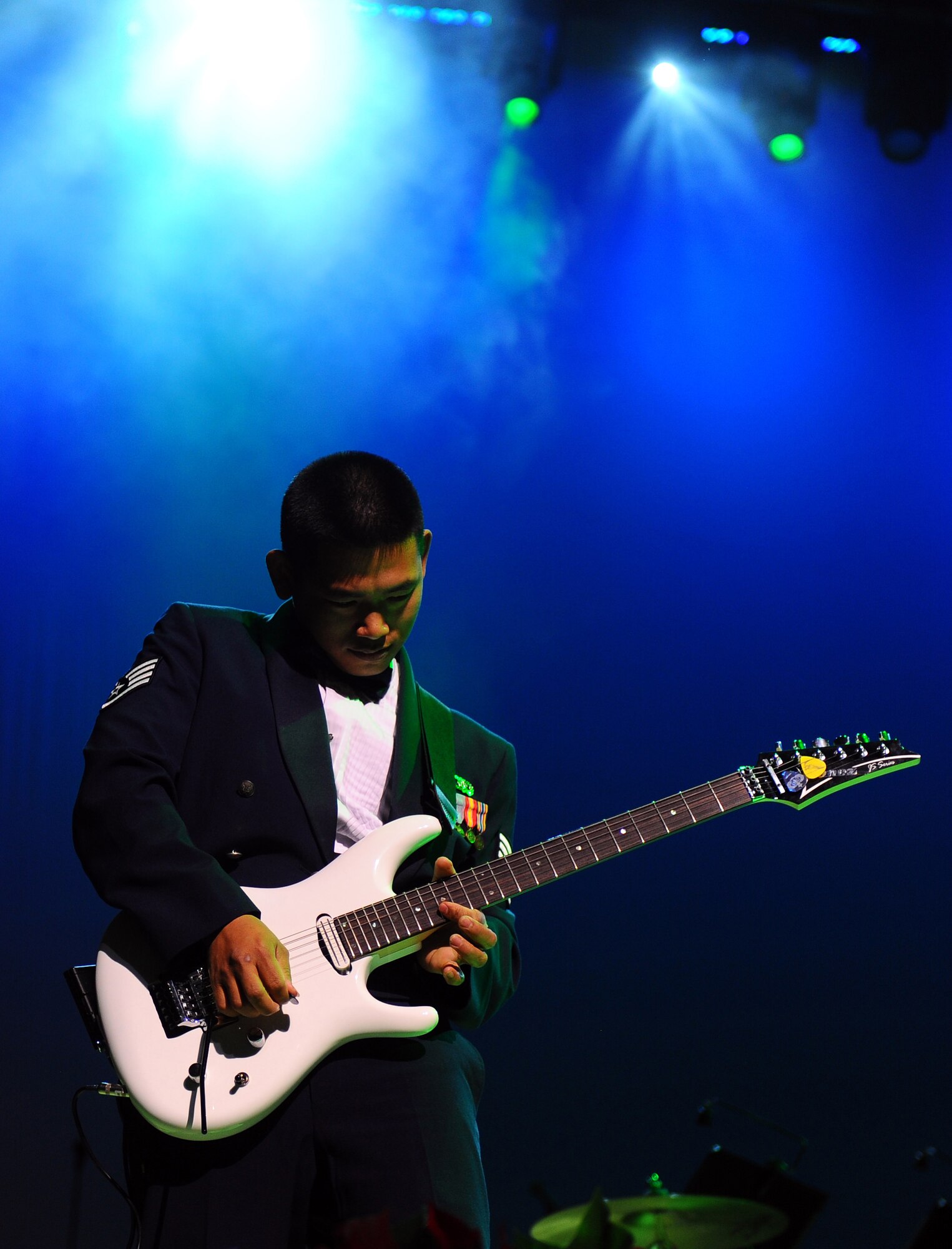 OFFUTT AIR FORCE BASE, Neb. - Staff Sgt. Daniel Santos, guitarist with the Heartland of America Band?s Night Wing ensemble, performs a rock ?n? roll remix of ?The Grinch Who Stole Christmas? theme song at the ?Christmas in Reel Time? annual holiday concert held at the Holland Performing Arts Center in downtown Omaha, Dec. 9.  The five-day concert series is comprised of six shows that usually find the Holland center at full capacity.  U.S. Air Force Photo by Josh Plueger (Released)