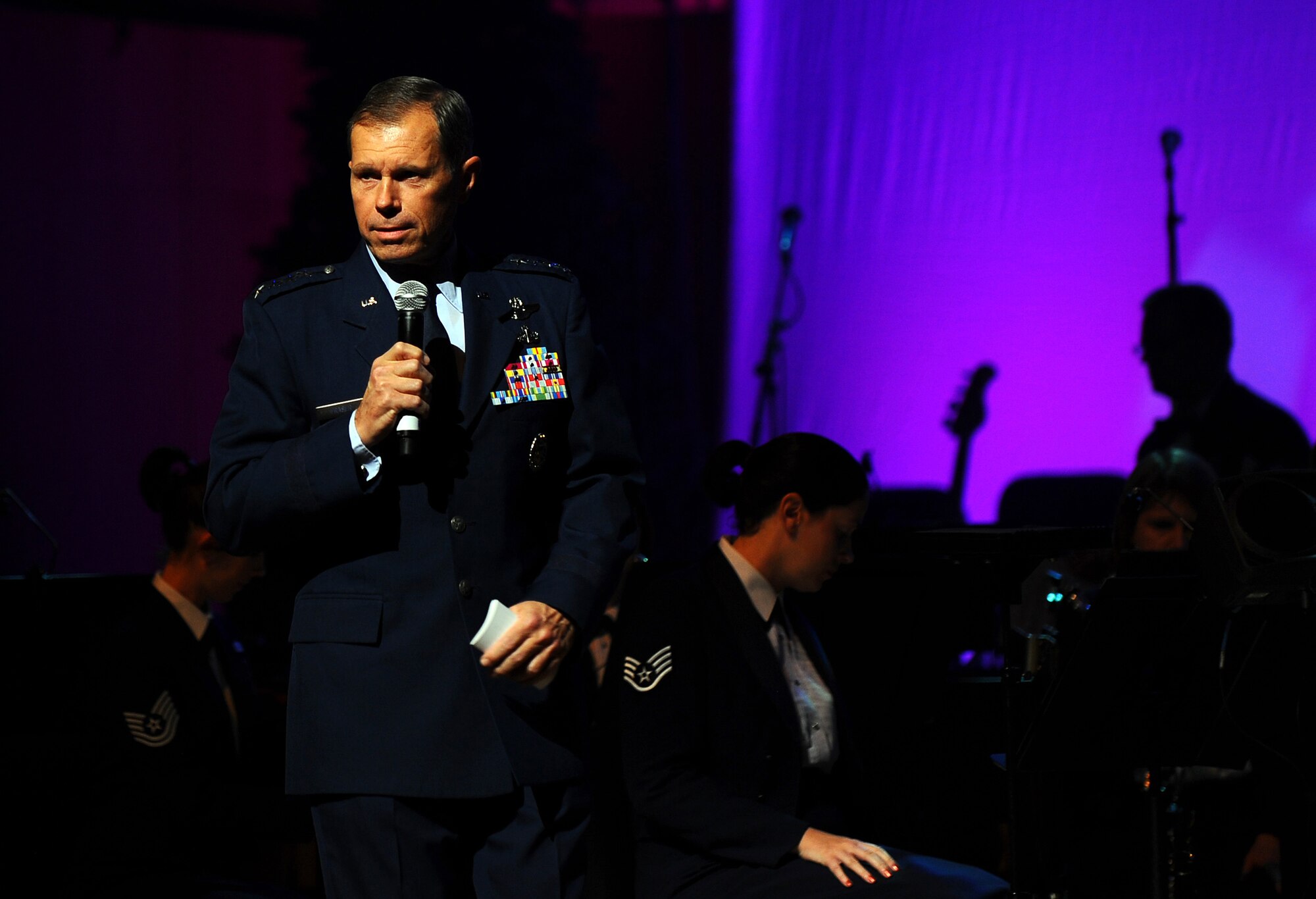 OFFUTT AIR FORCE BASE, Neb. - Gen. William M. Fraser III, Air Combat Command commander, provides opening remarks to concert goers at the Heartland of America Band?s holiday concert held at the Holland Performing Arts Center in downtown Omaha, Dec. 9. The Heartland of America Band annually work with the Omaha World Herald to provide a free concert for the local community. U.S. Air Force Photo by Josh Plueger (Released)