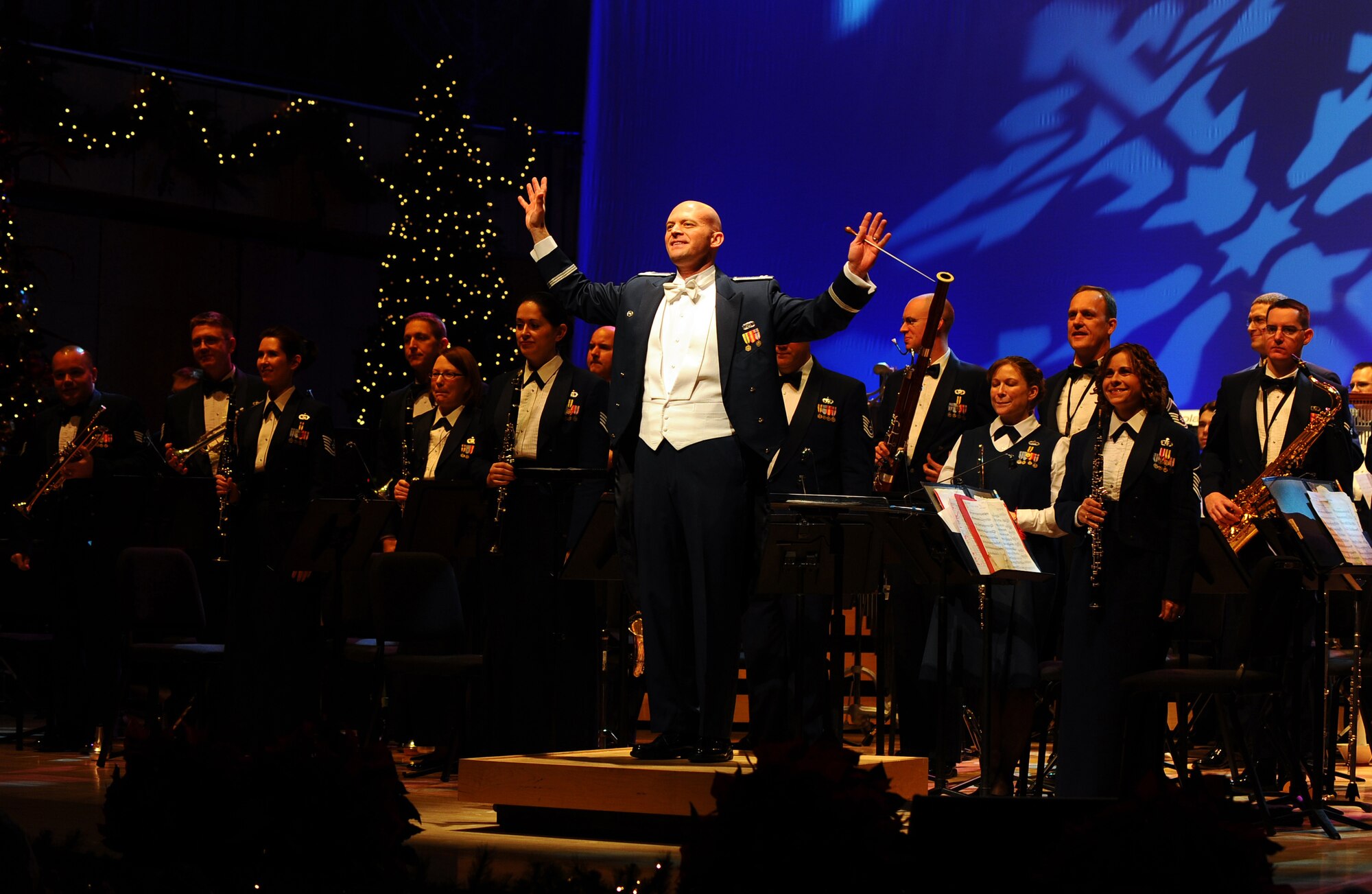 OFFUTT AIR FORCE BASE, Neb. ? Captain Michael Hoerber, United States Air Force Heartland of America Band commander and conductor, takes a bow following the opening song of the ?Christmas in Reel Time? annual holiday concert held at the Holland Performing Arts Center in downtown Omaha, Dec. 9.  The five-day concert series is comprised of six shows that usually find the Holland center at full capacity.  U.S. Air Force Photo by Josh Plueger (Released)