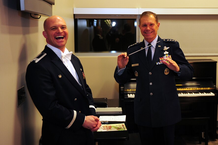OFFUTT AIR FORCE BASE, Neb. - Gen. William M. Fraser III, Air Combat Command commander, poses with Capt. Michael Hoerber, Heartland of America Band commander, prior to the annual holiday concert held at the Holland Performing Arts Center in downtown Omaha, Dec. 9. Captain Hoerber and the Heartland of America Band are responsible for providing Air Force musical outreach to Montana, Wyoming, North Dakota, South Dakota, Minnesota, Iowa, Nebraska and Kansas. U.S. Air Force Photo by Josh Plueger (Released)