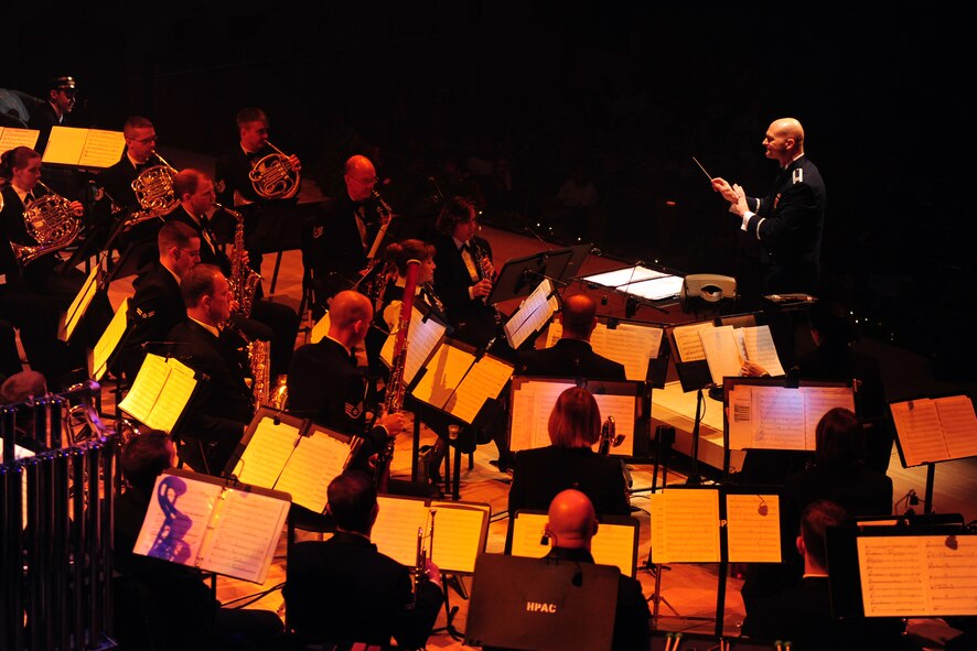 OFFUTT AIR FORCE BASE, Neb. ? Captain Michael Hoerber, United States Air Force Heartland of America Band commander and conductor, leads the concert band following intermission of the "Christmas in Reel Time" annual holiday concert held at the Holland Performing Arts Center in downtown Omaha, Dec. 9.  The five-day concert series is comprised of six shows that usually find the Holland center at full capacity.  U.S. Air Force Photo by Josh Plueger (Released)