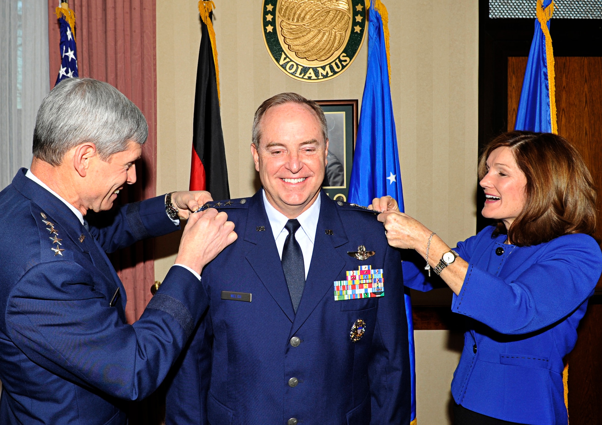 Air Force Chief of Staff Gen. Norton A. Schwartz and Betty Welsh pin on the forth star of Gen. Mark A. Welsh III in a brief ceremony immediately before taking command of U.S. Air Forces in Europe, Ramstein Air Base, Germany, Dec. 13, 2010. Gen. Welsh is responsible for Air Force activities, conducted through 3rd Air Force, in an area of operations covering almost one-fifth of the globe. (U.S. Air Force photo by Airman 1st Class Desiree Whitney Esposito)