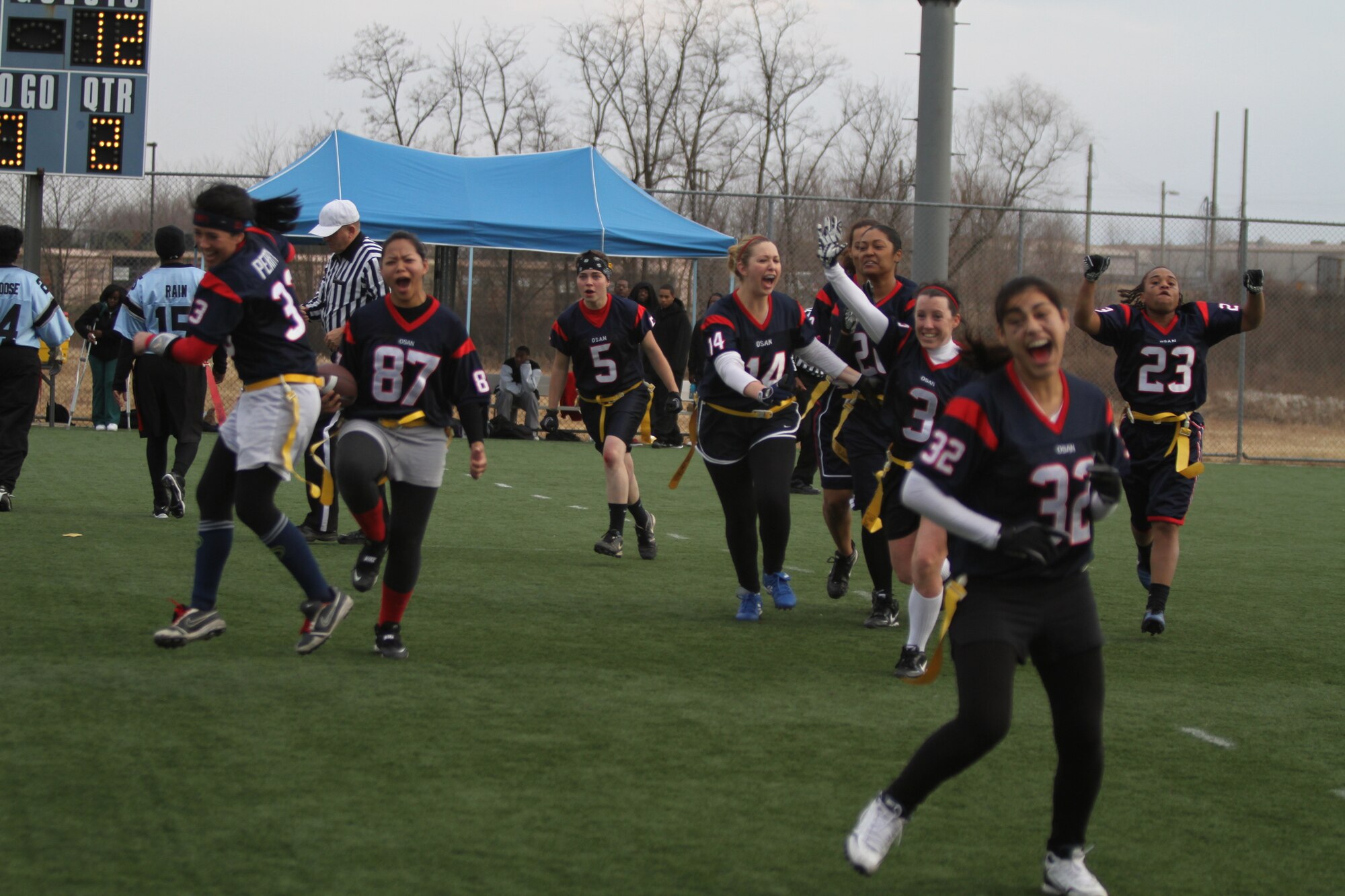 The ‘Lady Stangs’ celebrate after the final whistle following their 25-12 victory against Camp Humphreys II for the peninsula-wide flag football championship Dec. 5. (Courtesy photo)