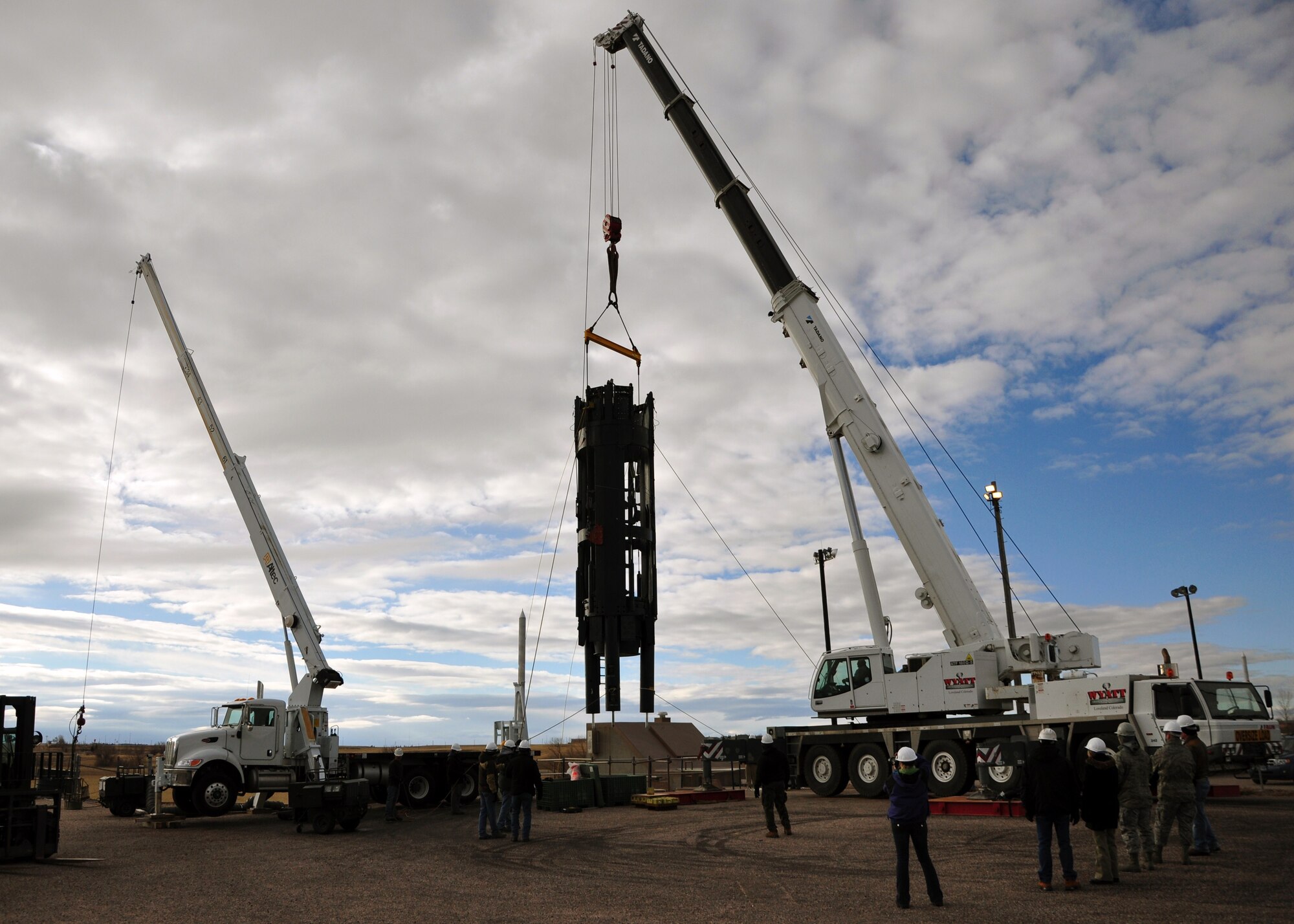 A maintenance team from Hill Air Force Base, Utah, hoists a missile support system out of Warren's training launch facility silo Dec. 7 at Uniform-1. The estimated weight of the MSS is more than 47,000 pounds and took the team about three hours to extract. The system is being shipped off for repairs and refurbishment, and while it is removed members of the 90th Maintenance Group will be performing corrosion control and other types of preventative maintenance in the training silo. (U.S. Air Force photo by Staff Sgt. Chad Thompson)