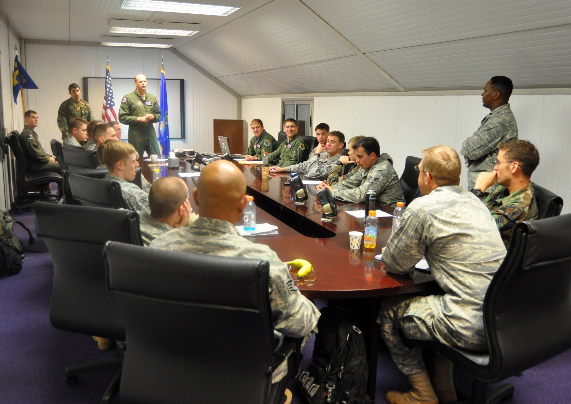 Lt. Col. Gregory Sarakatsannis, 510th Fighter Squadron commander and F-16 pilot, talks with 8th Air Support Operations Squadron tactical air control party operators and fellow pilots Dec. 2, 2010 in the 8th ASOS' conference room during a lessons learned "hotwash" from missions the Airmen worked together on while deployed to Afghanistan earlier this year. (U.S. Air Force photo/Tech. Sgt. Lindsey Maurice)
